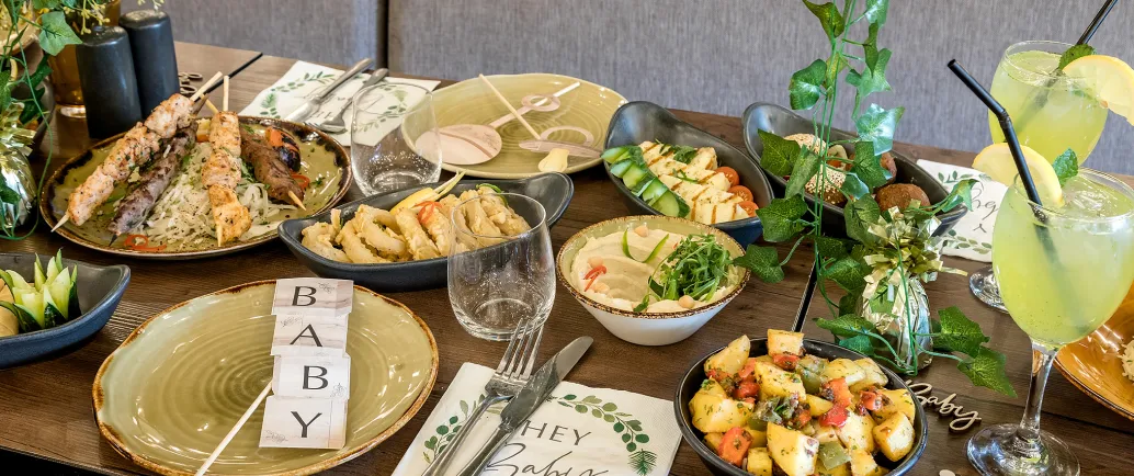 Lebanese table filled with colourful mezze and shared platters
