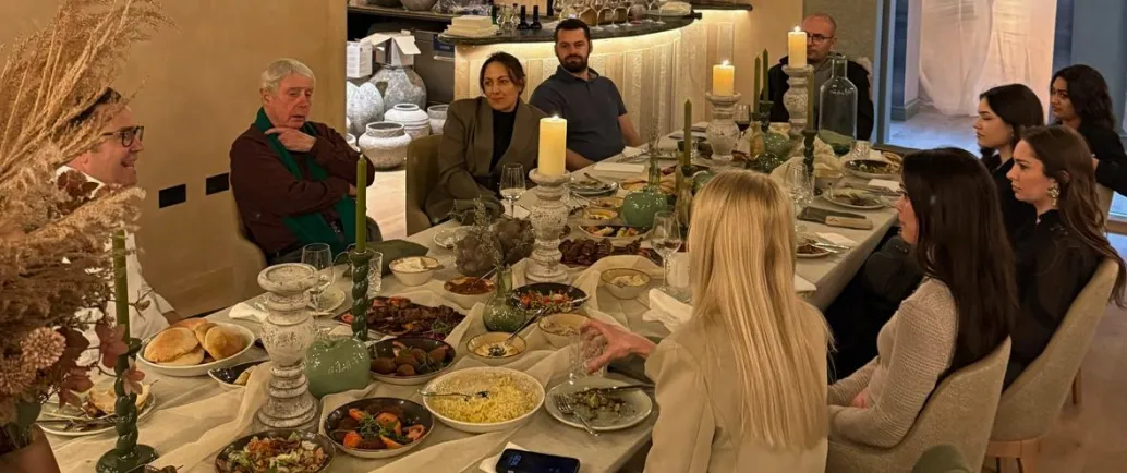 family member sharing a meal and enjoying conversation
